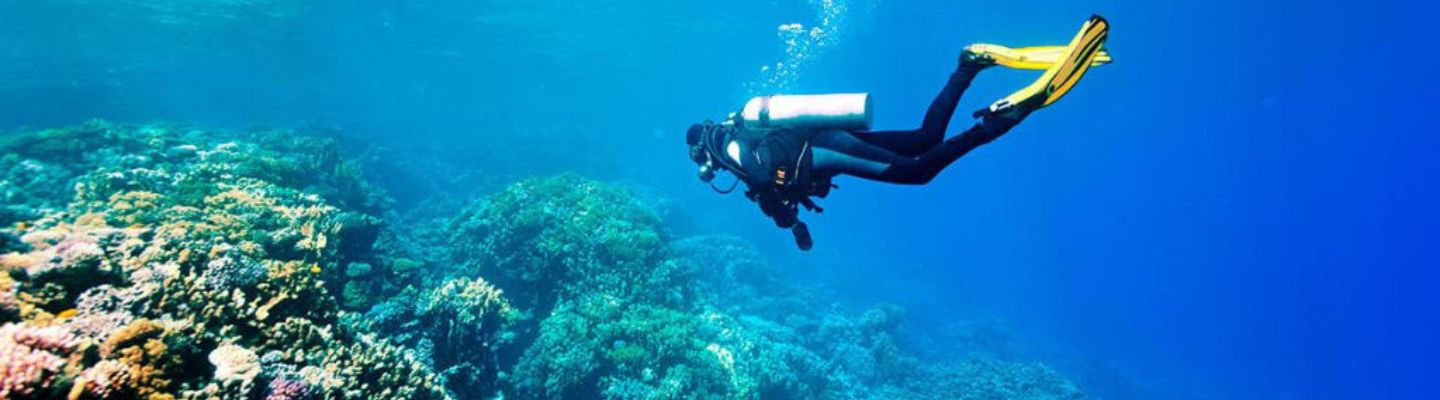 Tourist enjoying snorkeling in the clear blue waters of Andaman